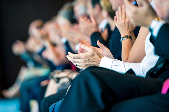 stock-photo-48985452-businesspeople-applauding
